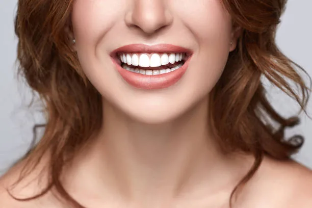 close-up photo of a woman with perfect white teeth