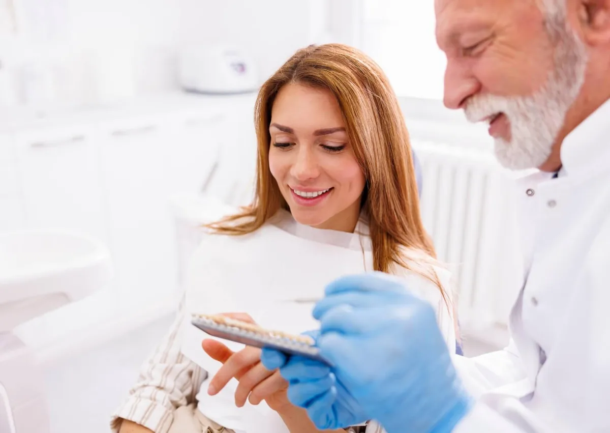 Patient discussing veneer options with a dentist to decide if veneers are worth it for her smile.