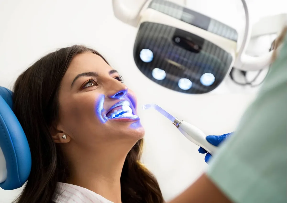 Patient receiving professional teeth whitening treatment to help maintain a brighter smile.